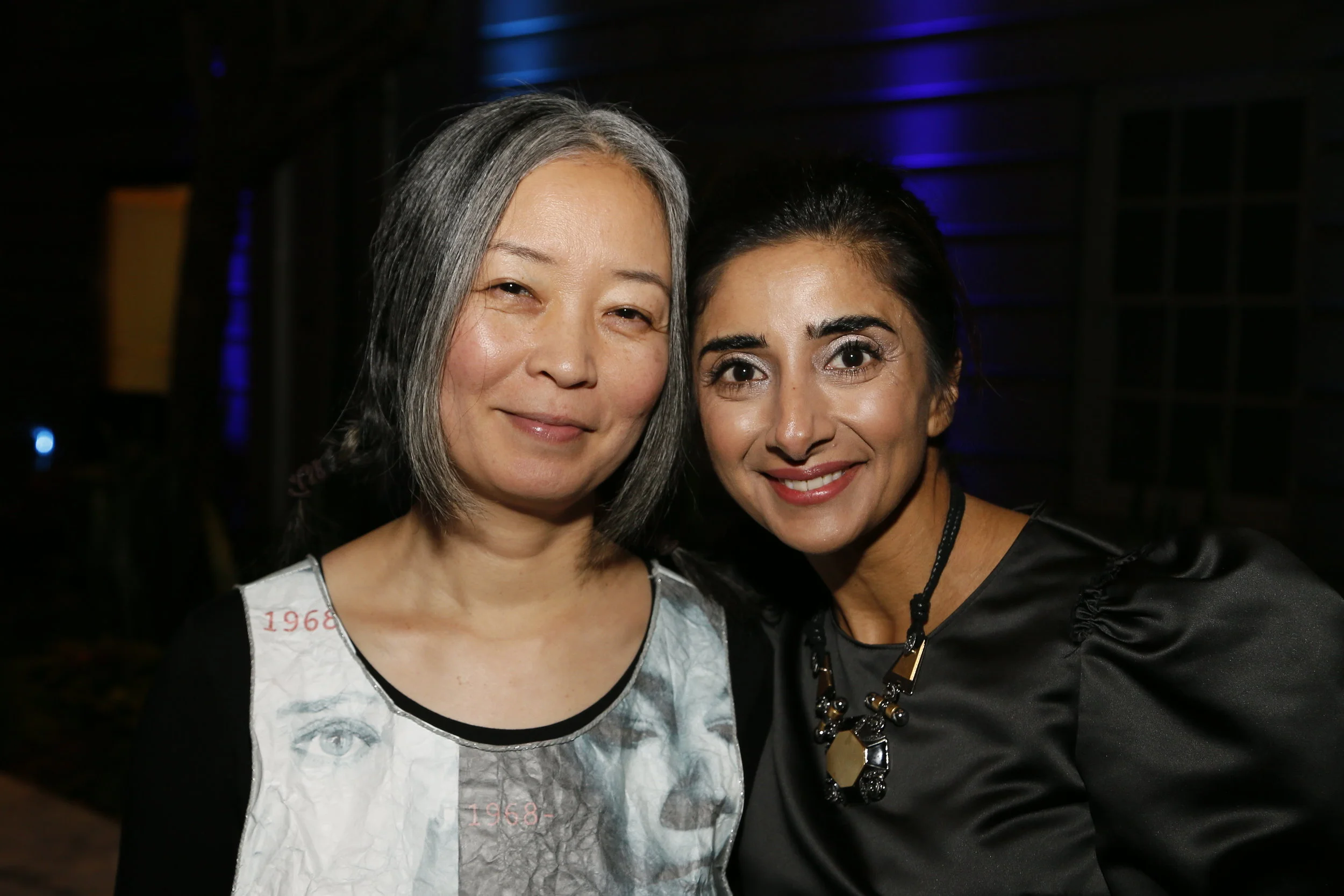 Artist Kumi Yamashita, left, and curator Asma Naeem, right, attend the "Face Forward Artist Party" at the Smithsonian's National Portrait Gallery on Saturday, November 10, 2018, in Washington. ©Photo by Paul Morigi/AP Images for National Portrait Gallery)