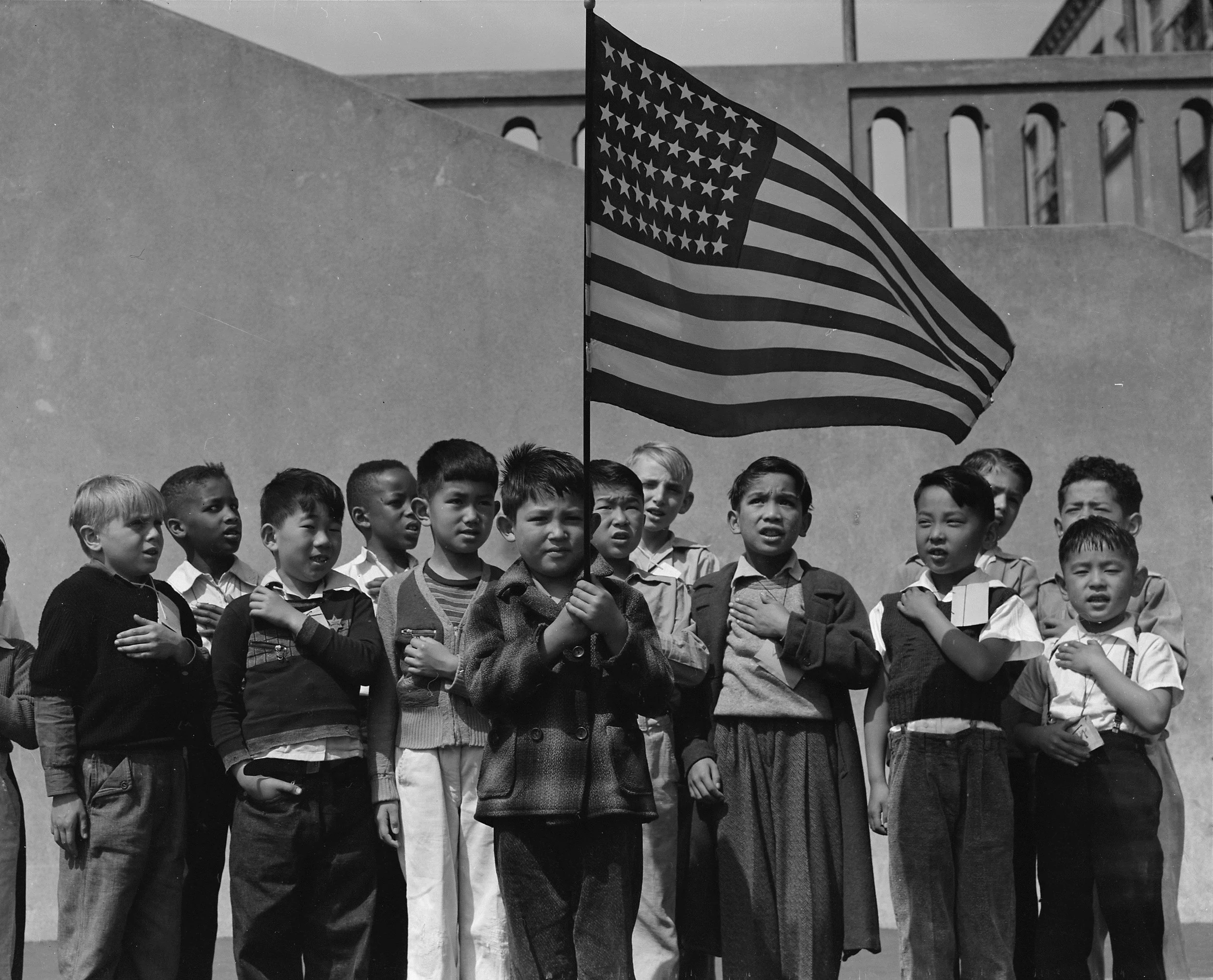 San Francisco, California. Flag of allegiance pledge at Raphael Weill Public School, Geary and Buchanan Streets. Children in families of Japanese. © Dorothea Lange