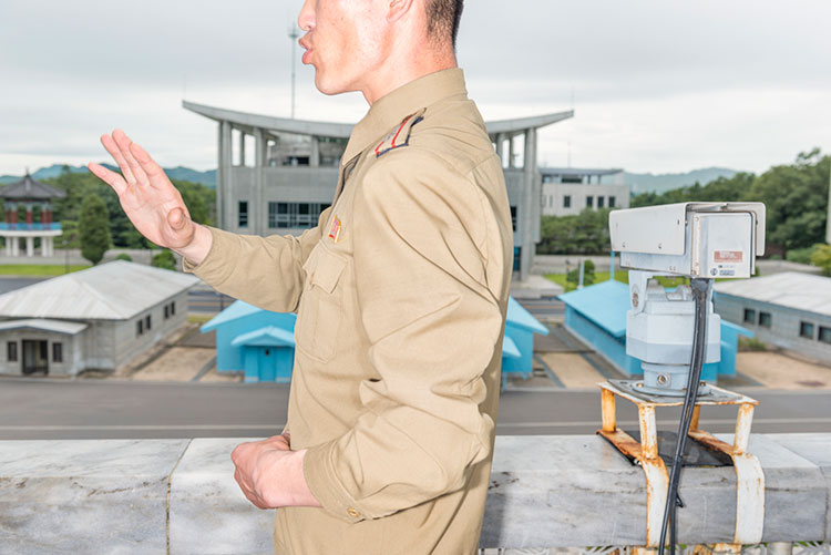 View on South Korea from the balcony at the DMZ building, shown by military guide. © Max Pinckers