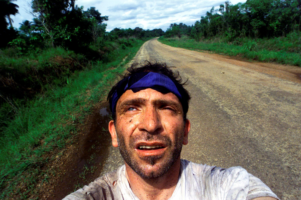 Yannis Behrakis takes a self portrait after surviving an ambush by Revolutionary United Front rebels in the jungle of Sierra Leone in which Kurt Schork and Miguel Moreno were killed, 2000. ©REUTERS/Yannis Behrakis. Courtesy of the British Journal of Photography.