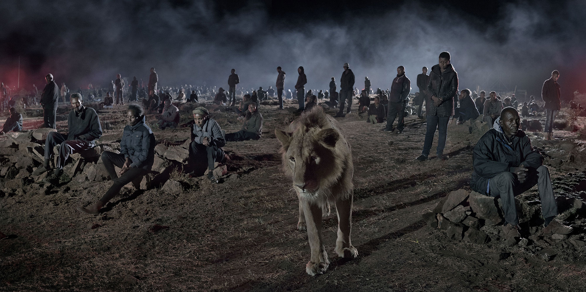 Savannah with Lion and Humans. © Nick Brandt
