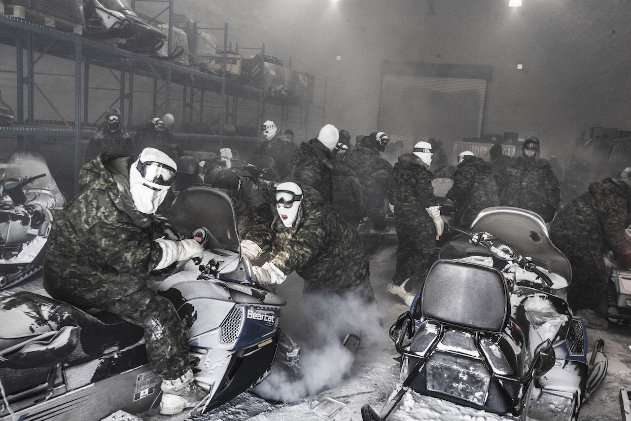 Resolute Bay, Canada, March 2018. ©Kadir von Lohuizen—NOOR for foundation Carmignac. Starting up snow scooters at extreme temperatures is a great challenge, as the fuel pumps often freeze. Courtesy of ArtNet.