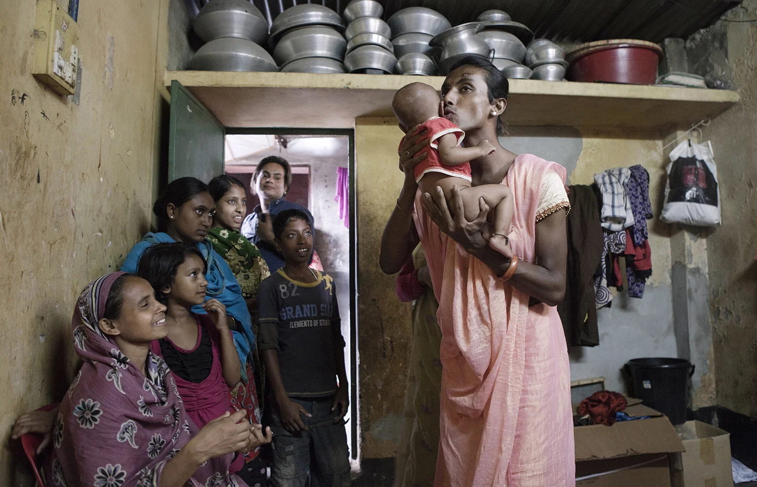 Fahim,22 years, during the ancient ritual of blessing of the newborn. Pakistan’s ghetto. Dhaka. © Raffele Petralla