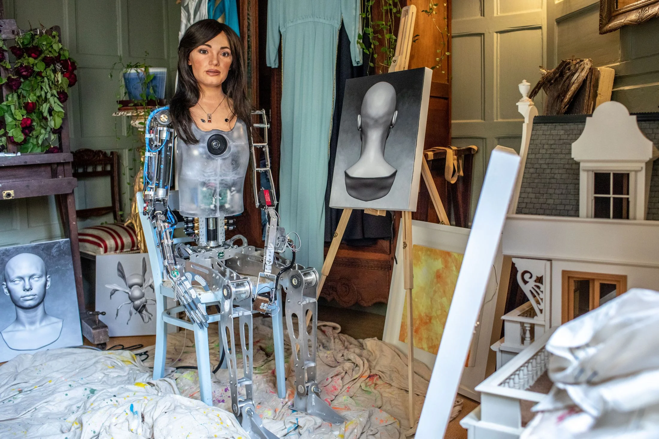 Ai-Da with her paintings. Photograph by Victor Frankowski.