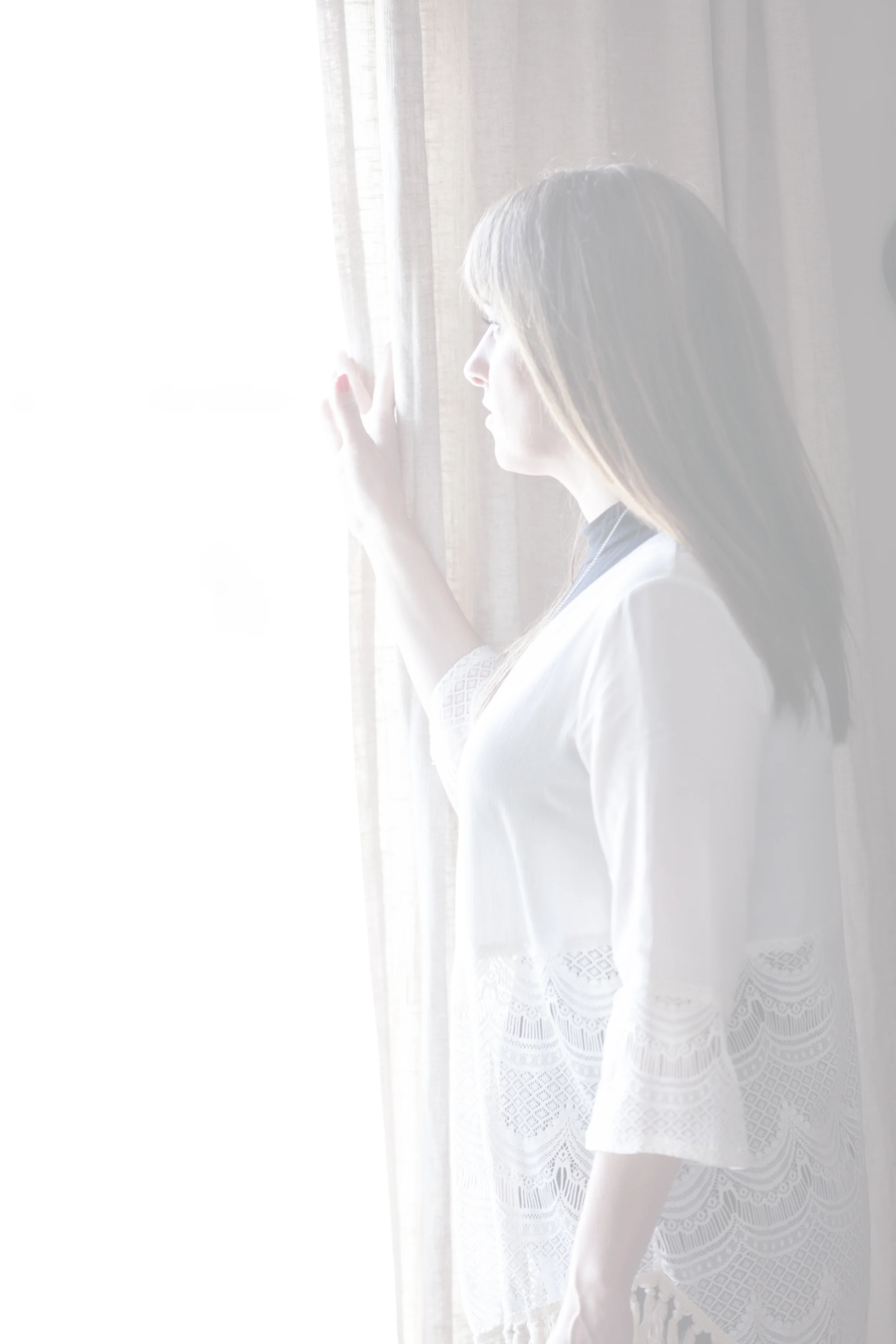 healing photoshoot - amy profile at window somber expression.jpg