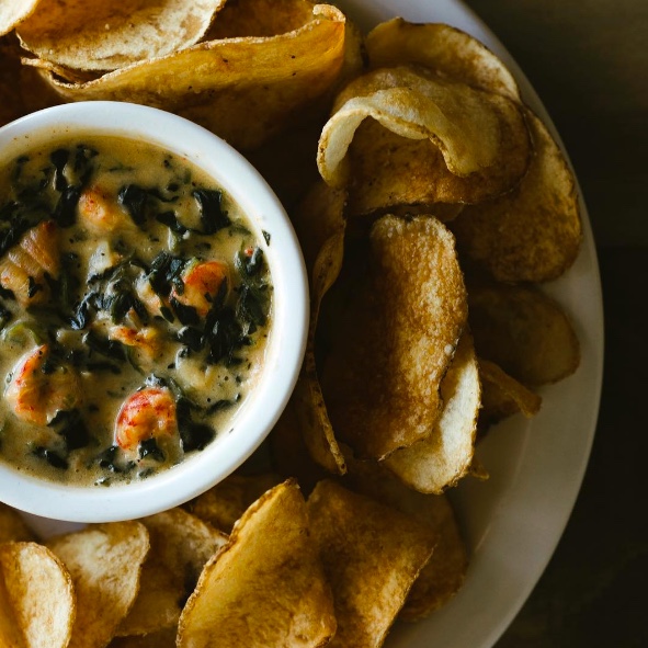 CRAWFISH & SPINACH DIP Louisiana crawfish tails, Parmesan cheese, fresh potato chips $24/6 servings