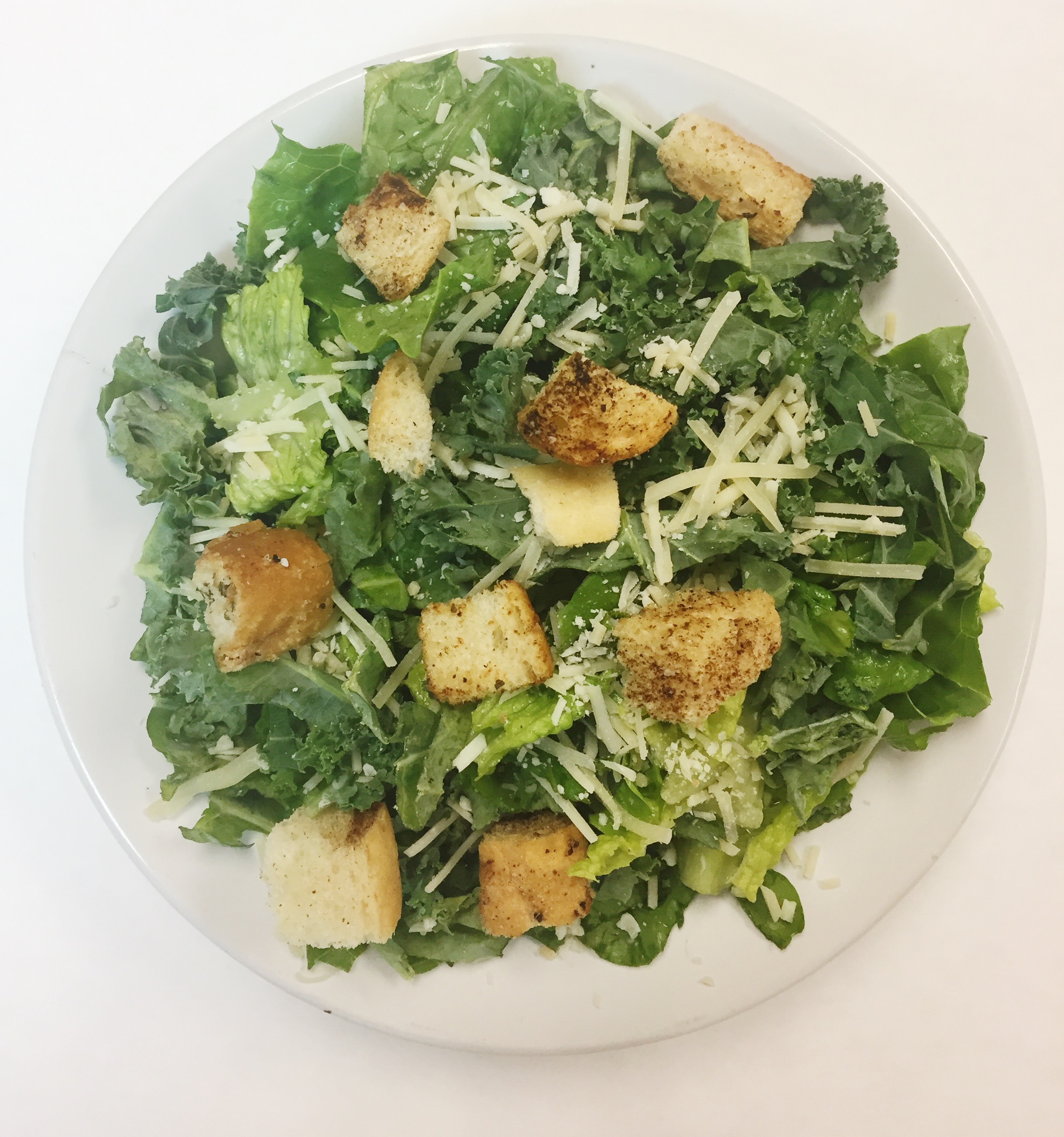 KALE CAESAR SALAD Shredded kale, crisp romaine, housemade croutons, Parmesan, creamy garlic-anchovy dressing $36/ 4-6 entrée servings or 8 appetizer servings *add chicken +$12, shrimp +$18