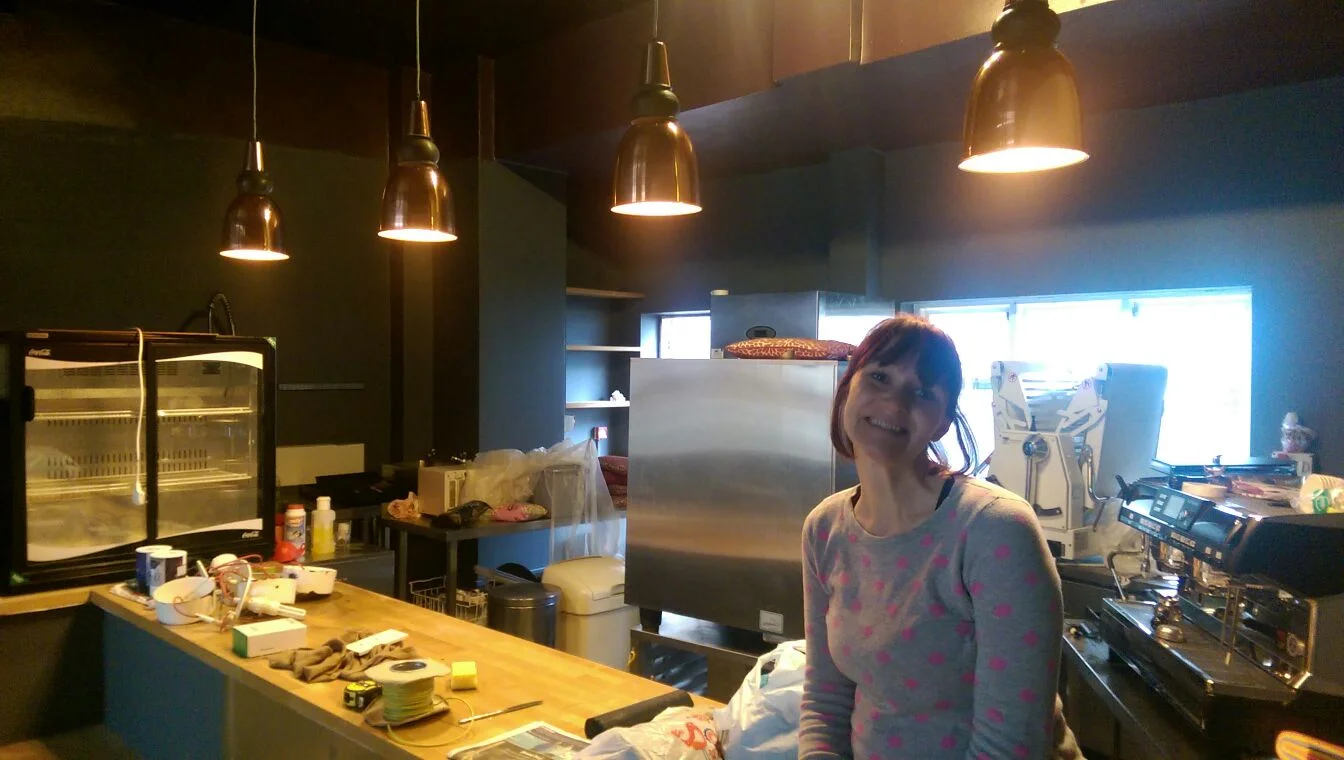 kitchen equipment slowly being put into place, copper bar lights installed!