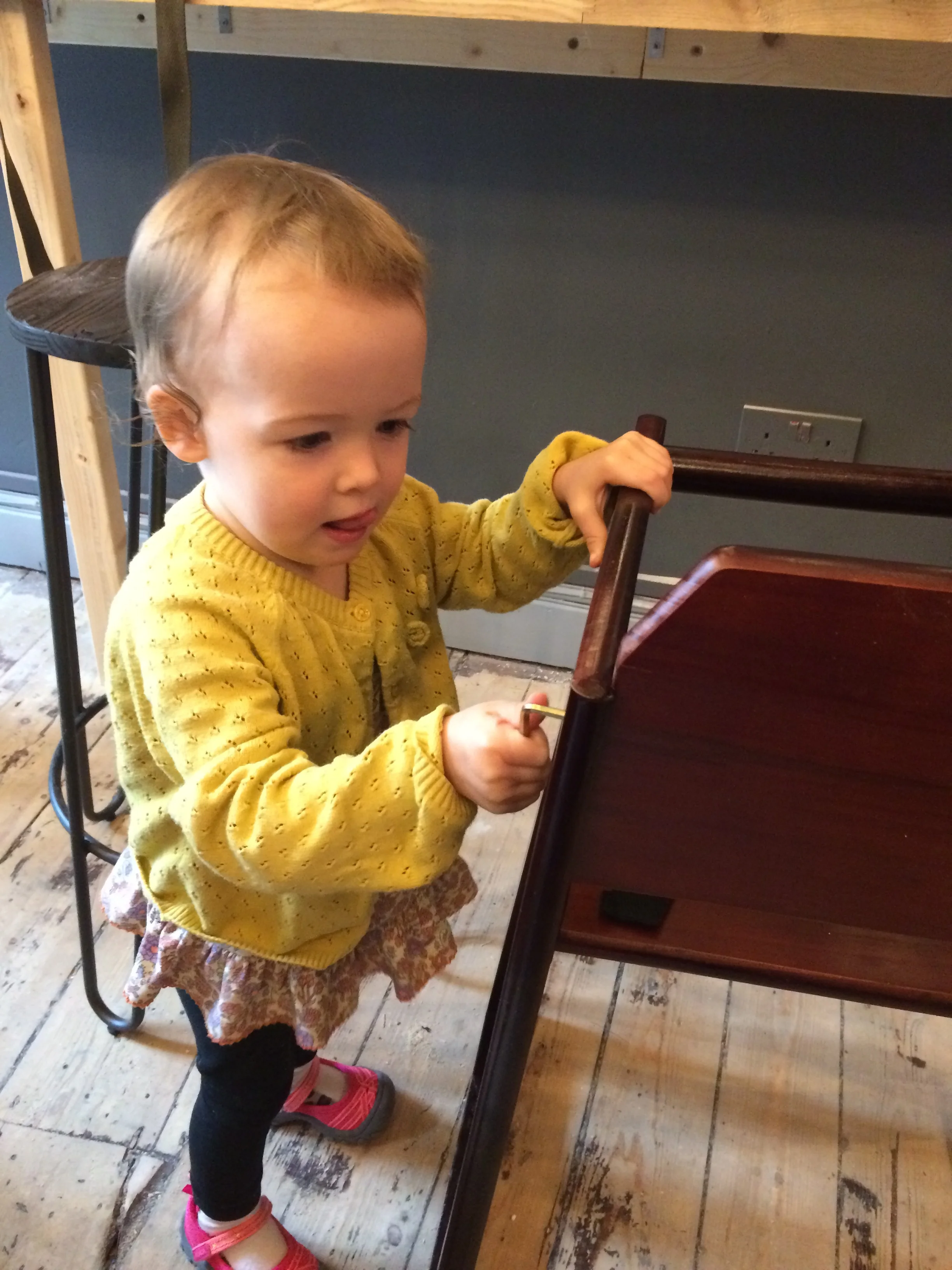 Ella helps build high chairs for new friends to use at Figbar!
