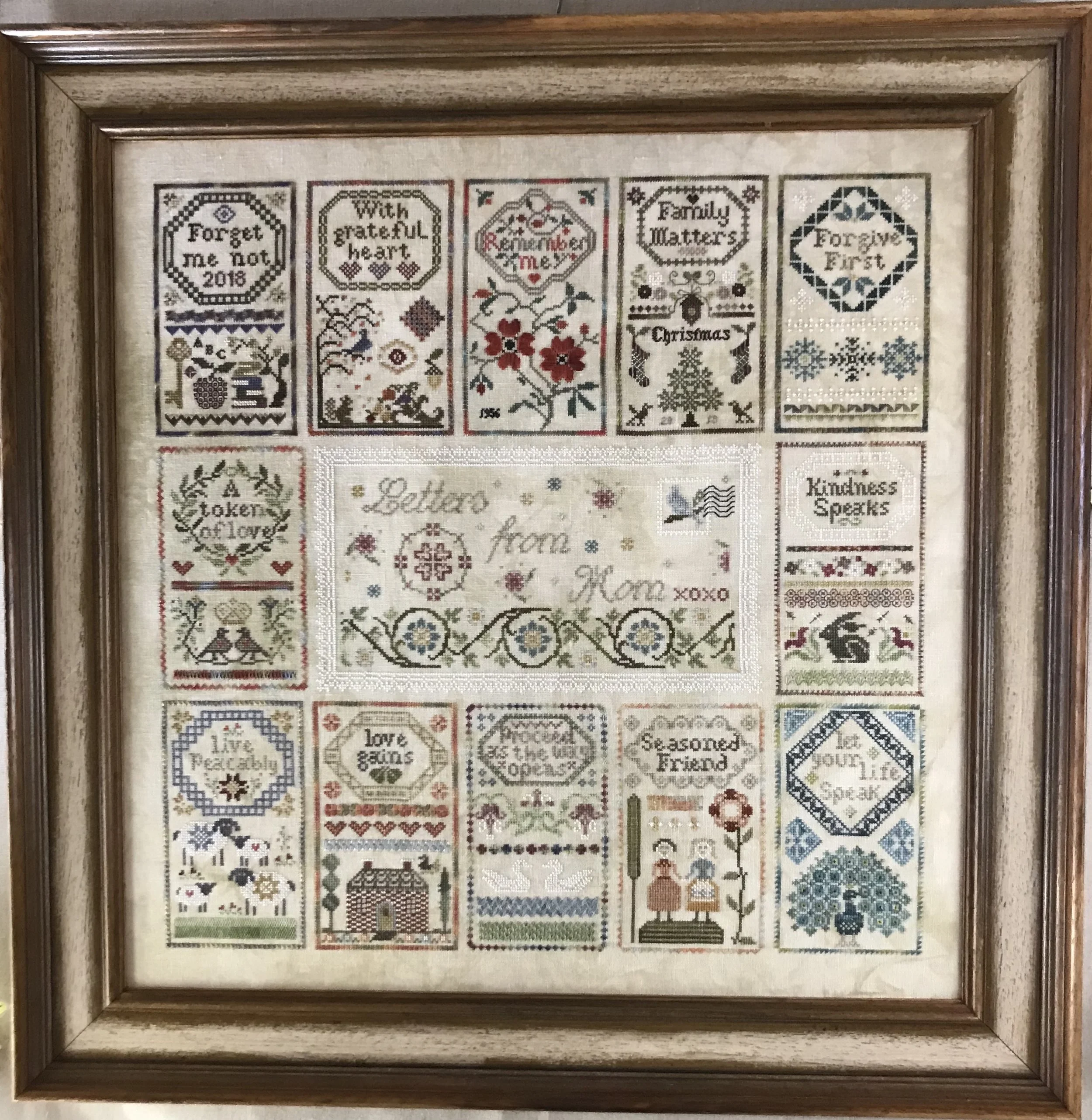 Letters from Mom stitched as a Sampler