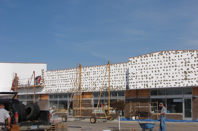 Re-facing the exterior of Midway Mall in a major renovation and facelift