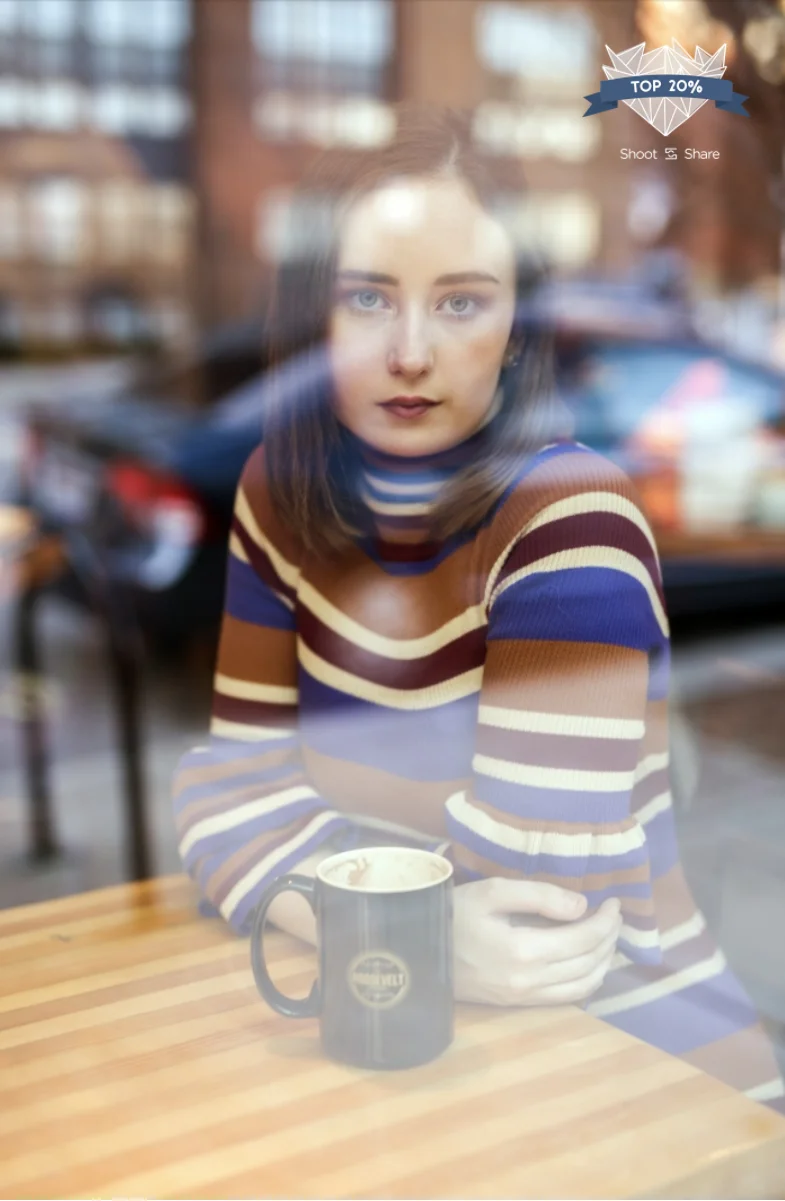 girl photographed through the window of a coffee shop in Columbus, Ohio.