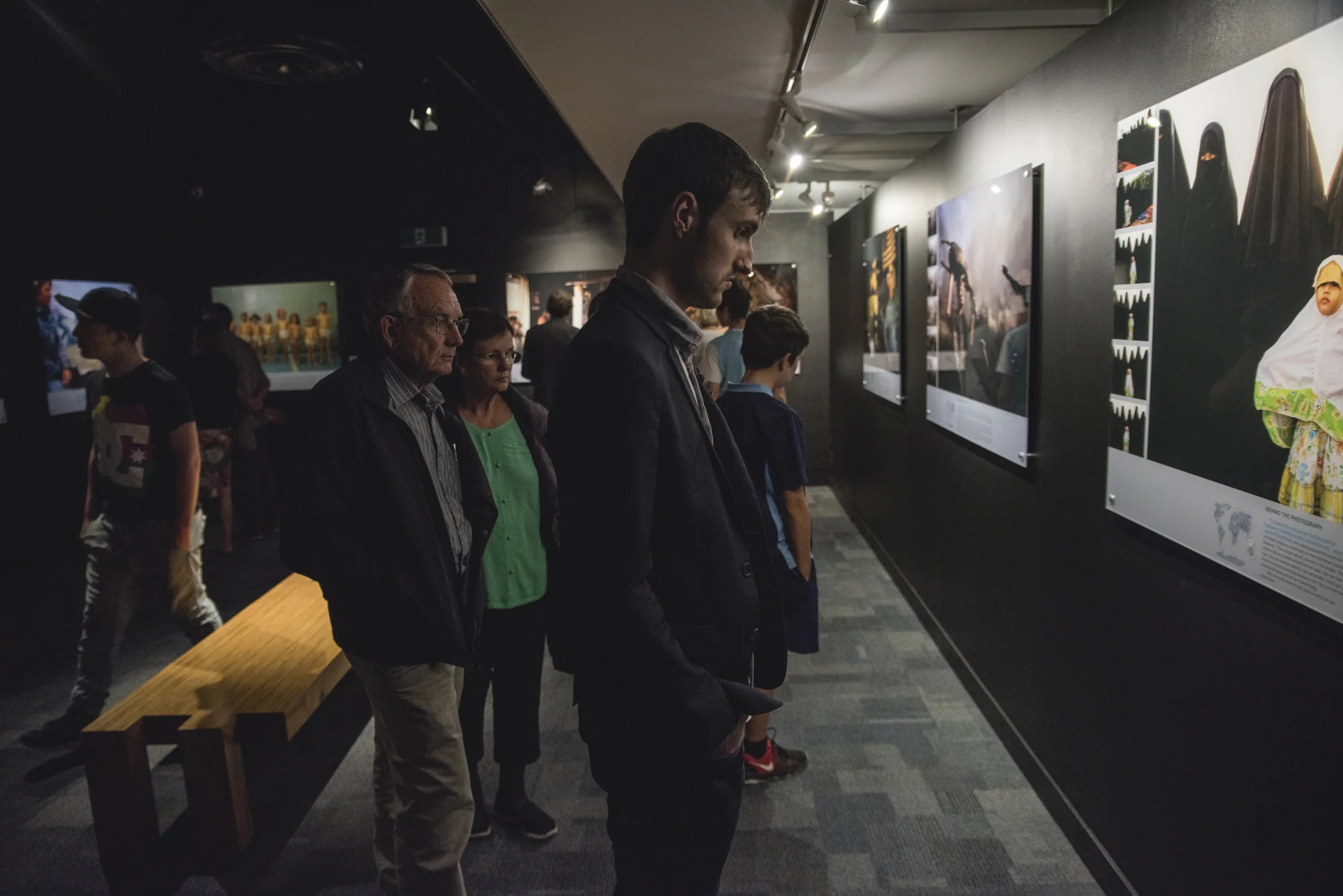VISITORS TO THE NATIONAL GEOGRAPHIC PHOTOGRAPHIC EXHIBITION 