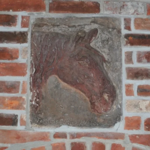 This clay tablet was sculpted in 1903 by Francis C. Pyle, an early owner of The Stone Barn farm, which was found during the renovation of the barn and is now displayed in the main entrance.