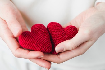 crop-hands-with-knitted-hearts_23-2147736882.jpg