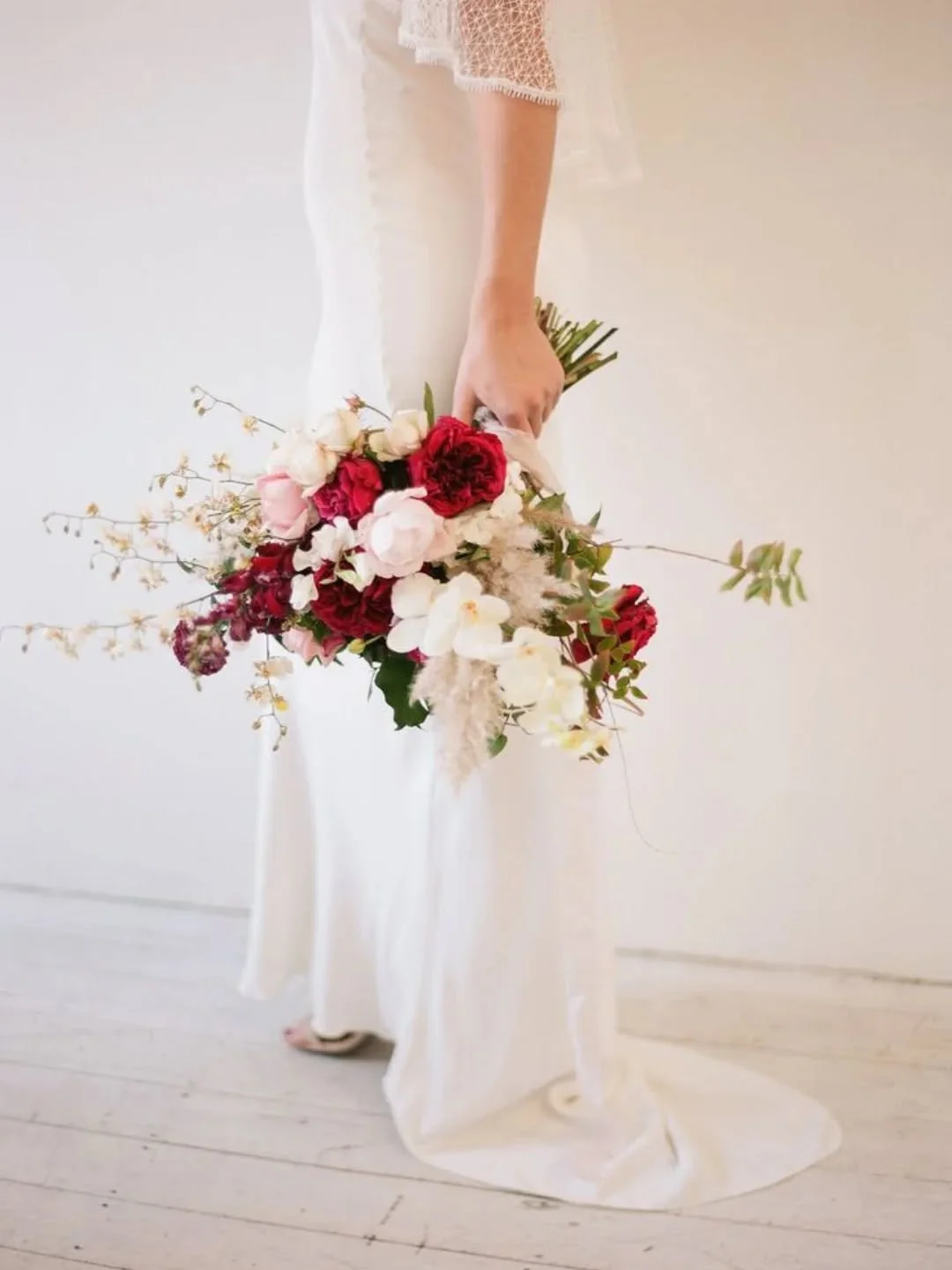 I N  R E D &amp;  W H I T E ❤️🤍
Our brides bouquet in timeless red and white &mdash; a palette that speaks of love, strength, and quiet elegance.
Rich crimson blooms layered with soft ivory tones, each stem chosen with intention to complement the be