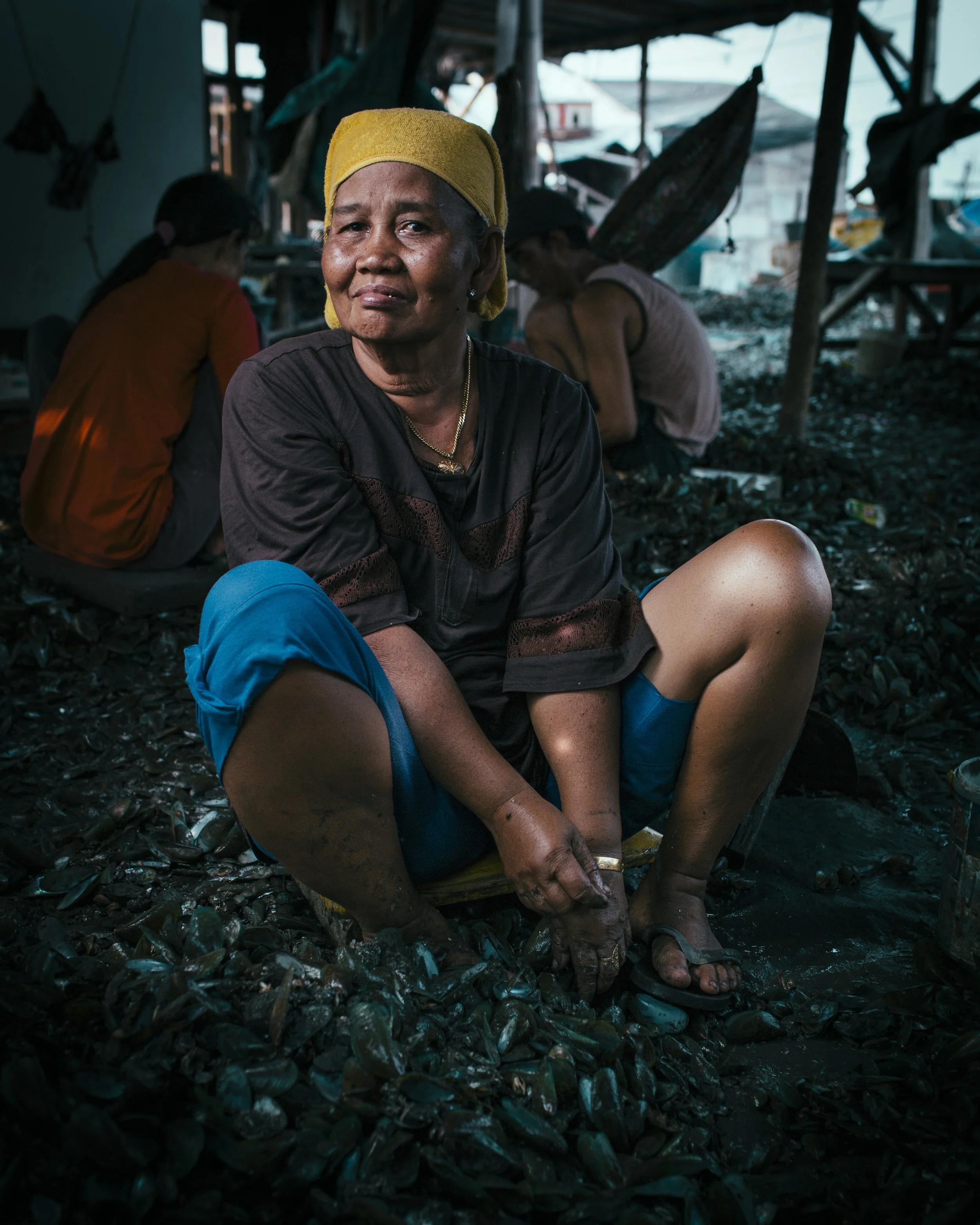 Lady Cleaning Mussels-Jakarta/Indonesia