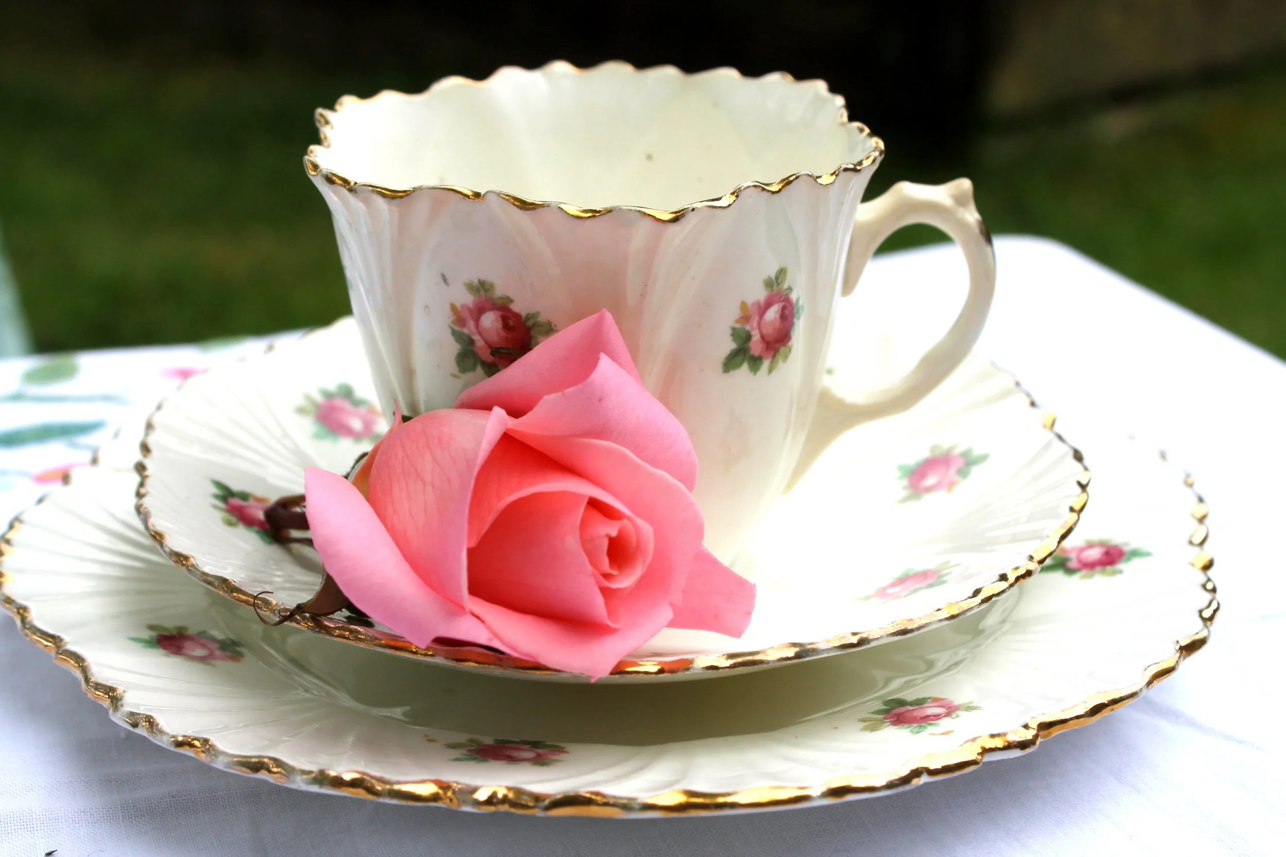 cups and saucers in pinks.JPG