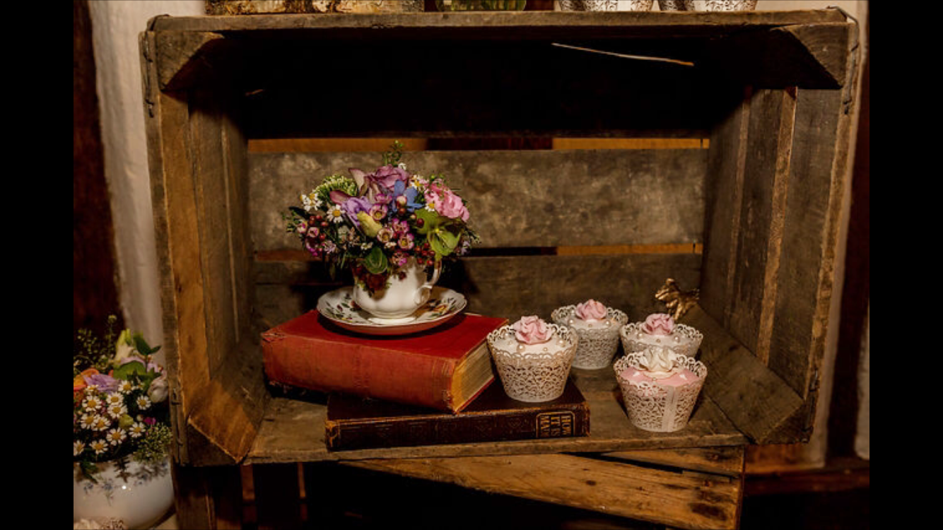 inspiration cups with flowers and books in crates.PNG