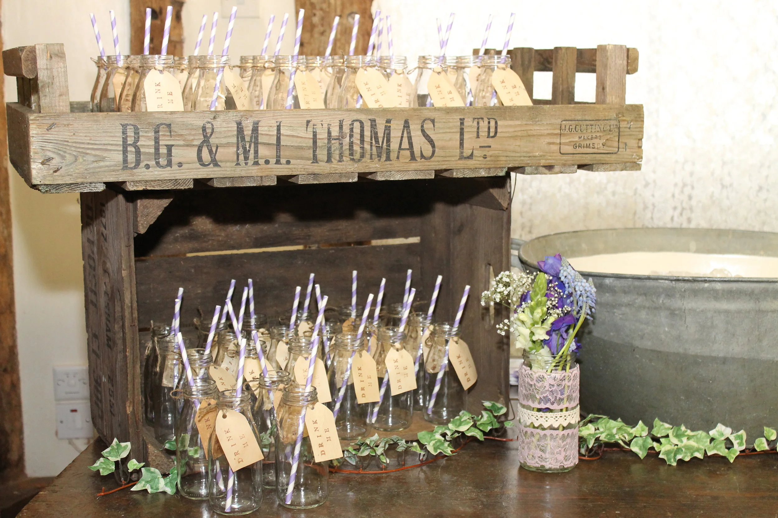 old school milk bottles with paper straws.JPG