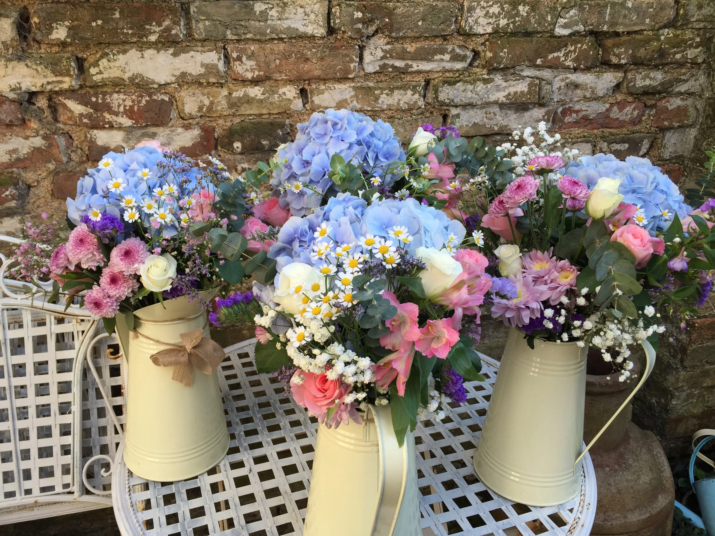 Farmhouse jugs with summer arrangements - flowers by Dollys 