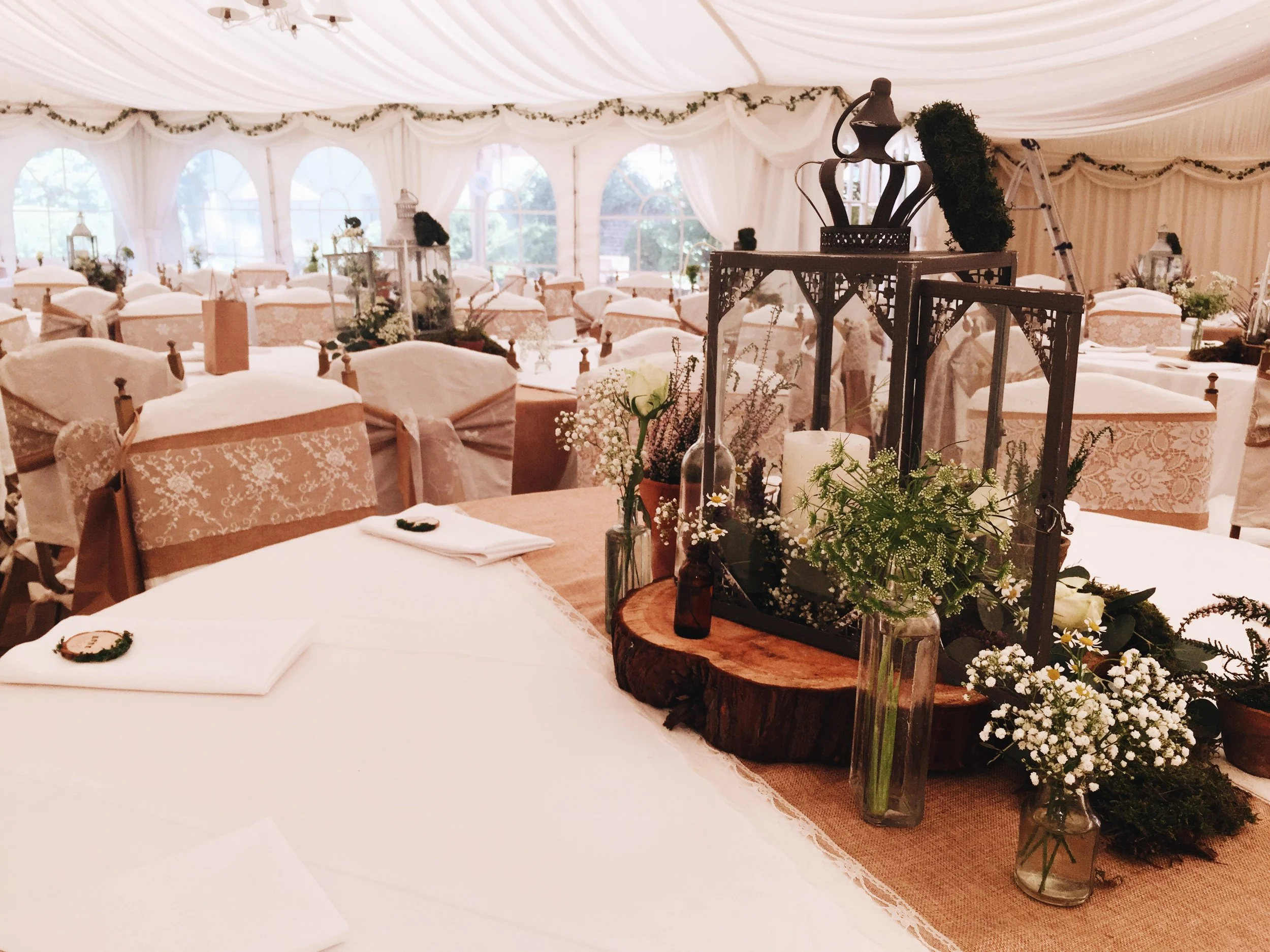 lanterns and folaige themed wedding tables