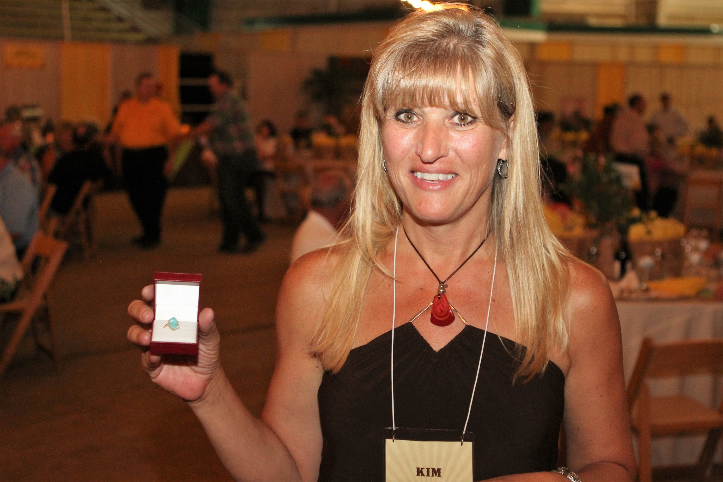 Showing off the fabulous ring before the live auction!
