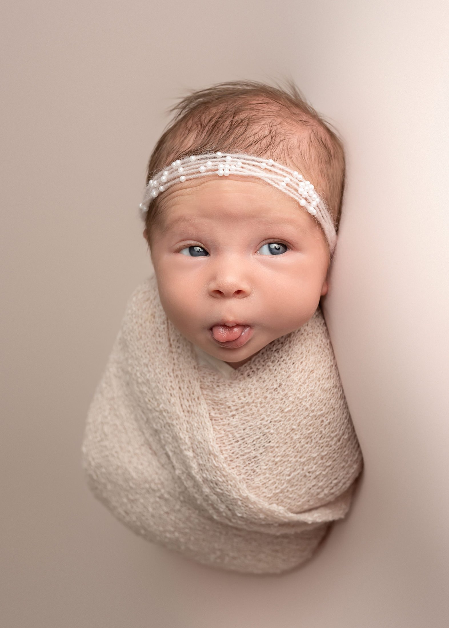 boca-raton-newborn-photography -baby-girl-tongue-out.jpg