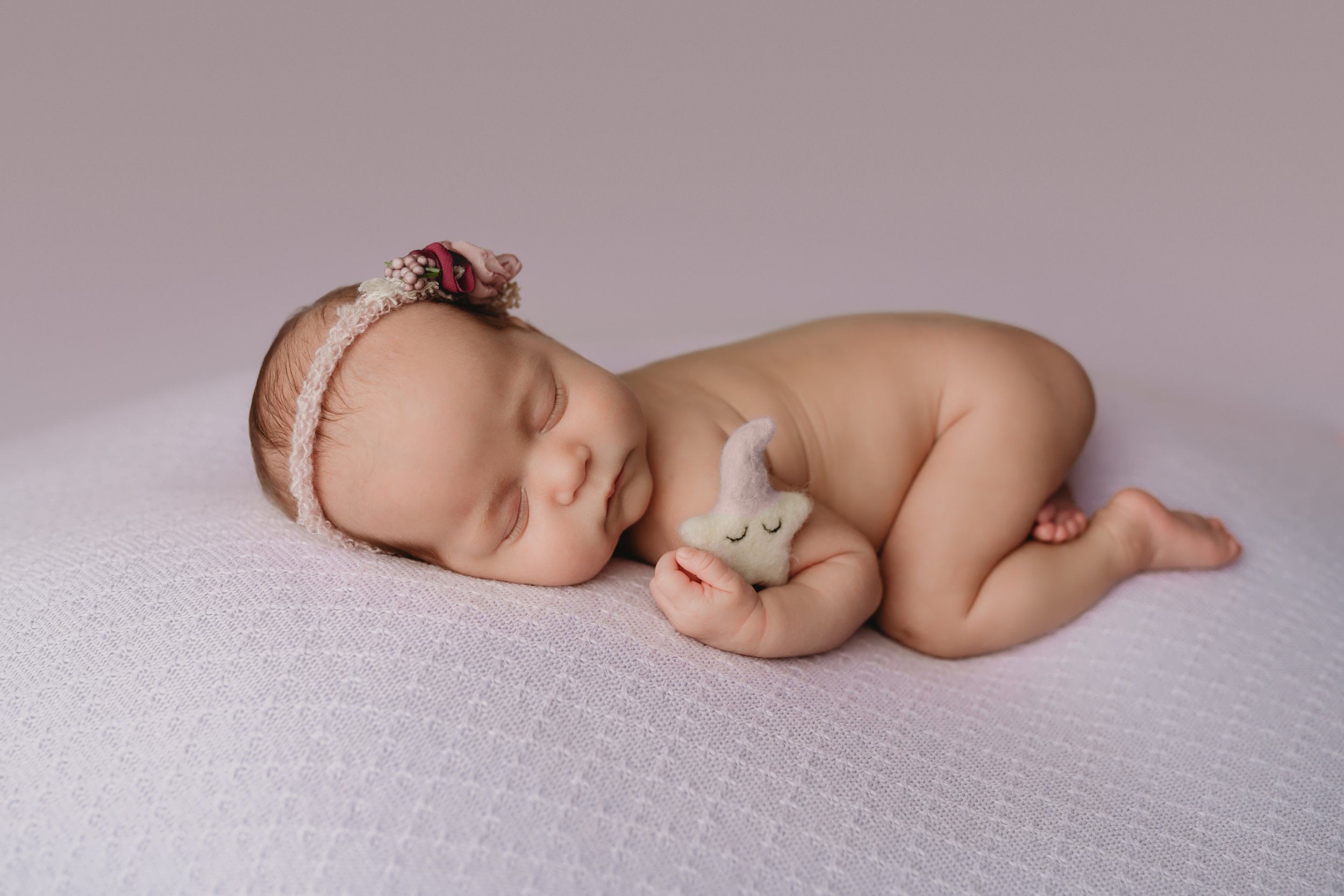 Boca-Raton-Newborn-Photographer-Baby-in-purple-Tushie-up