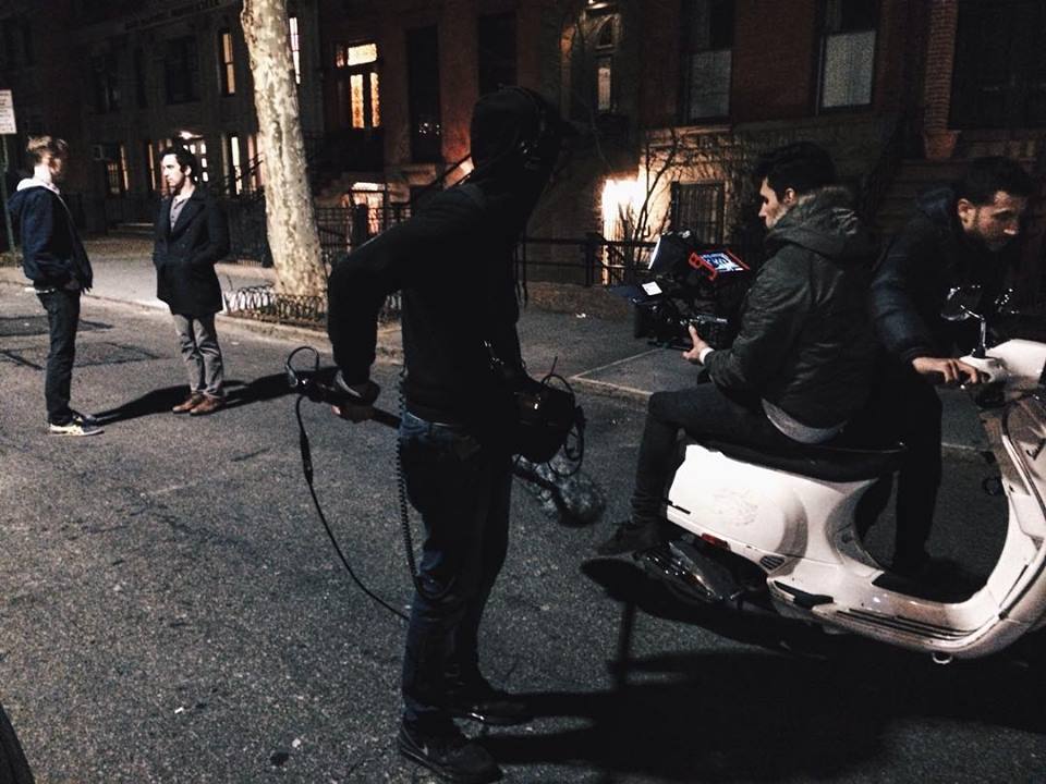Christopher Schaap and David Siciliano block a tracking shot with Aitor Mendilibar and Aharon Rothschild on Vespa, and Mike Hurst following