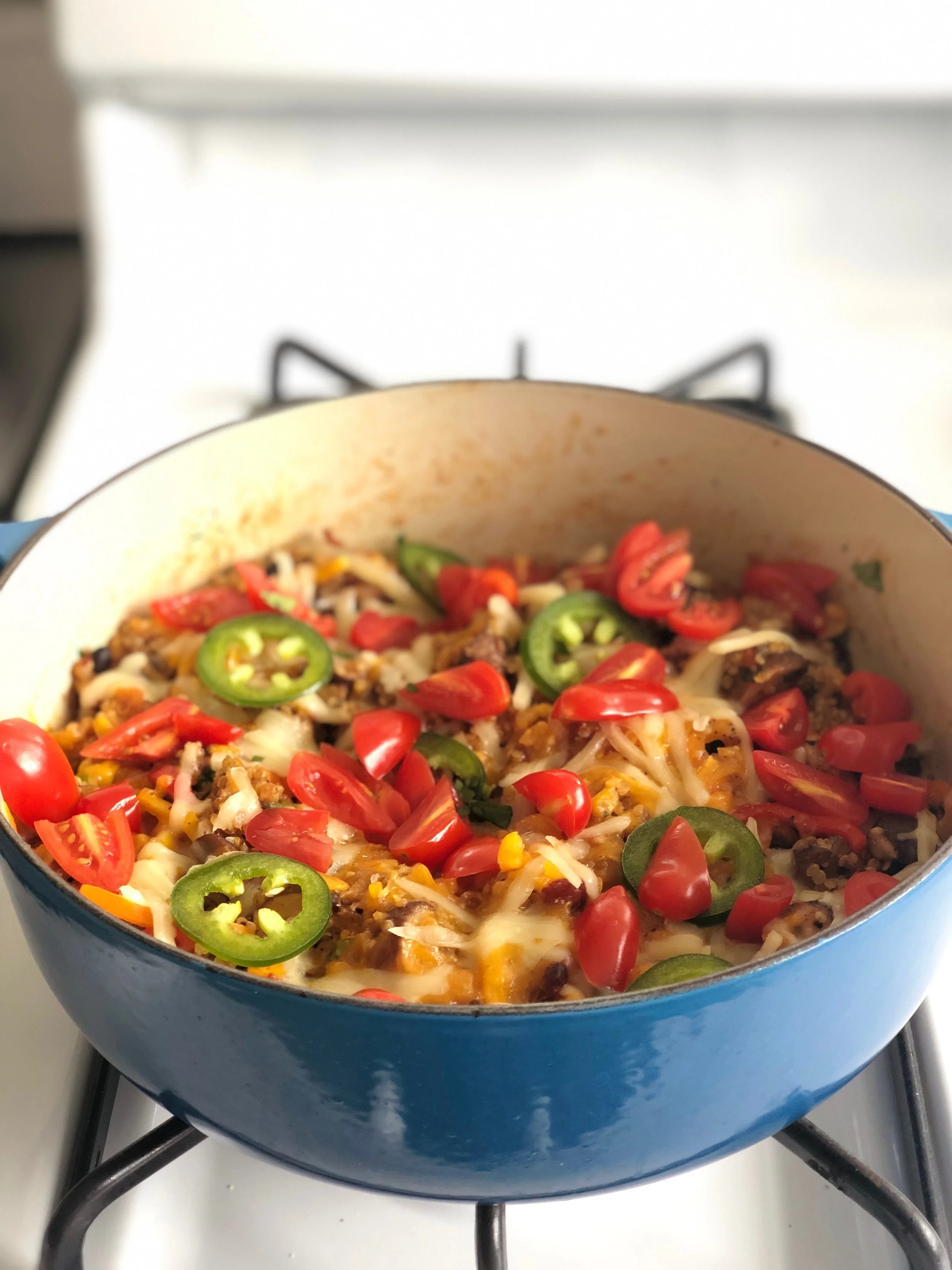 I uncovered and stirred, then added some shredded cheddar and mozzarella cheese and topped with shaved jalapeños. I baked it in the oven with 1/4 cup of water for about 15 minutes until the cheese was bubbly.