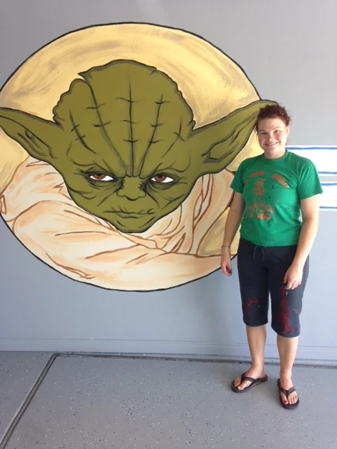 Rachel standing Proudly with her YODA!