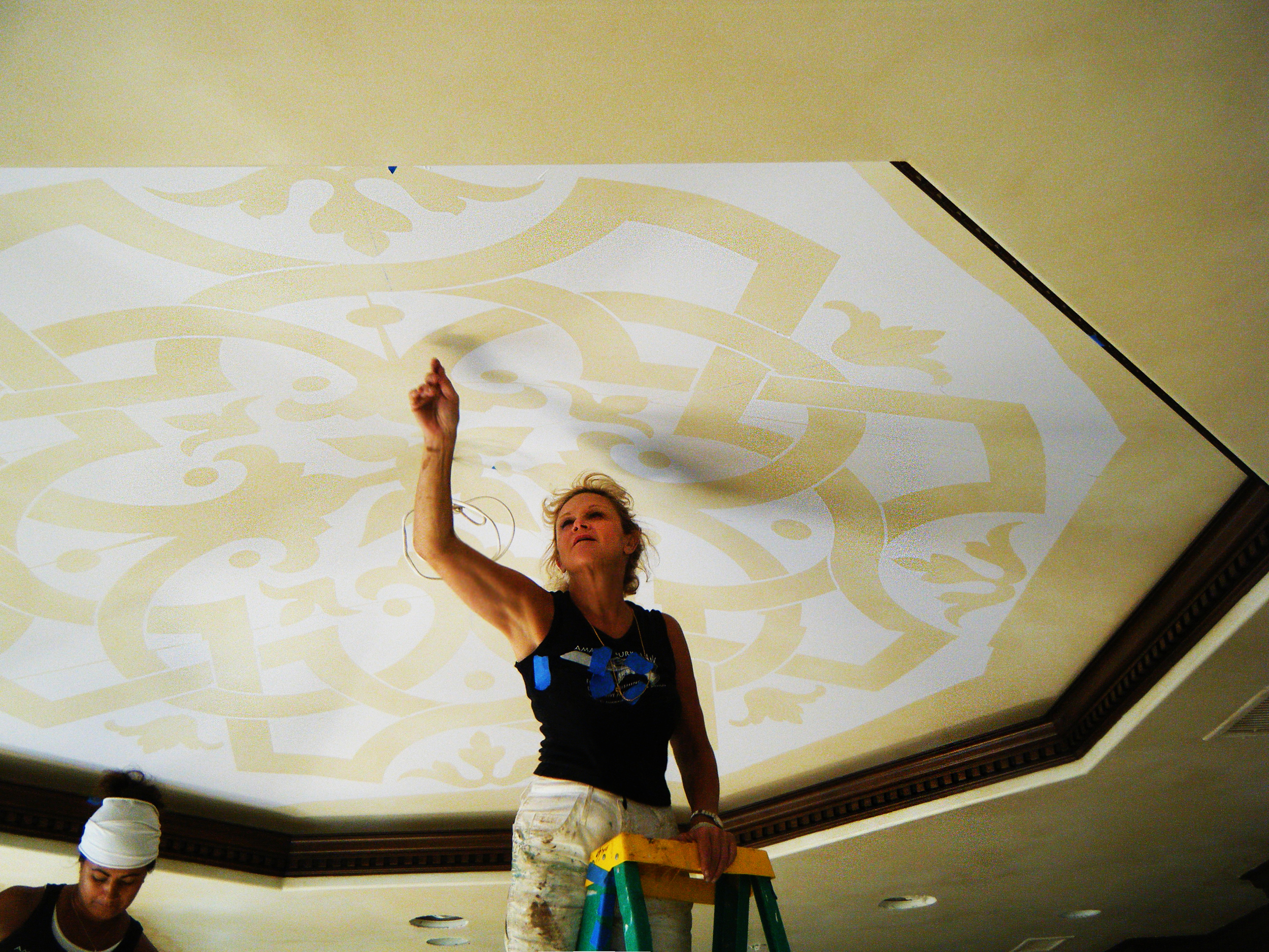  Recessed octagon ceiling with a hand painted Moorish inspired motif. 