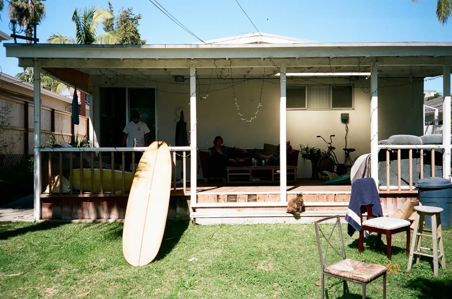 Steve's backyard, a place we all hang a lot. There's a fire pit to the right by the chairs and a huge tree with a couple hammocks hanging in it. San Diego, Ca. Shot by Tyler Annalora. 