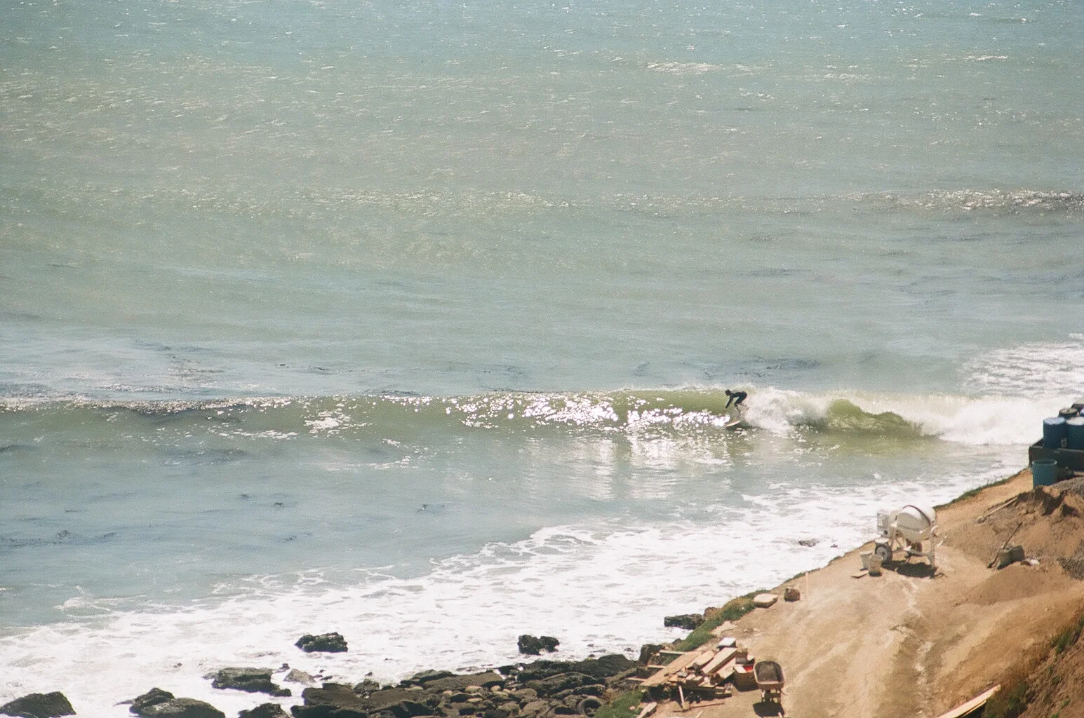 Steve about to get a little barrel. The only good wave all day perhaps. Shot by contributing artist Tyler Annalora. 
