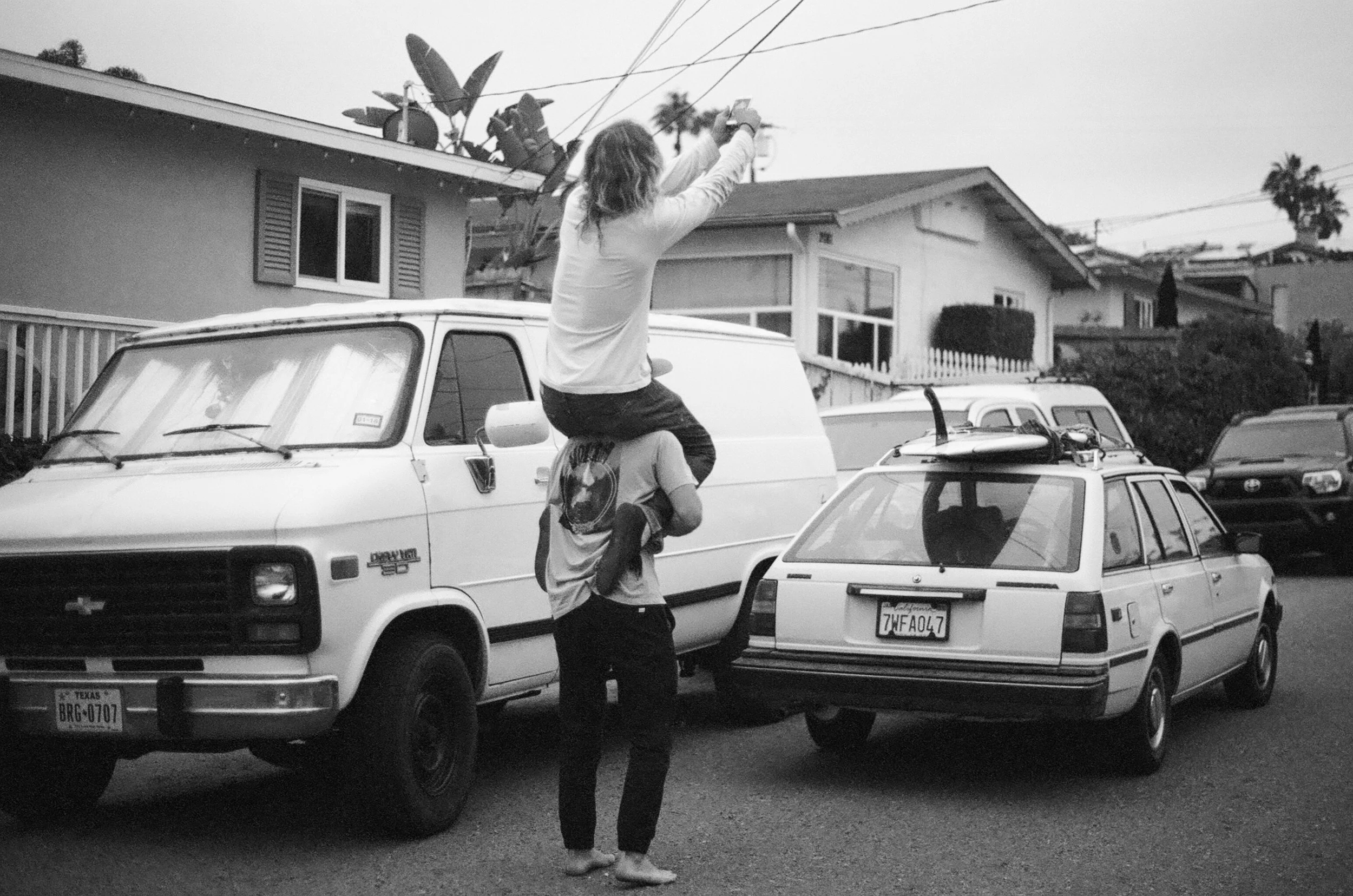 Ryder England and Josh Nassz. A picture of a picture. Ryder had to get a better angle of the Datsun so Josh stepped in to help a friend. All right before we went surfing. 