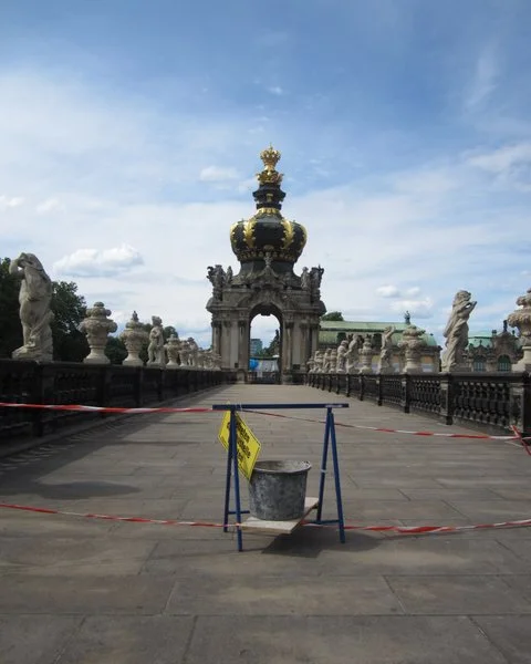 Construction on the top of one of the walls of the Zwinger Palace, Dresden, Germany.