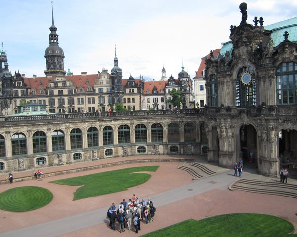 The Zwinger palace, the main palace of Augustus the Strong, built in the 18th century. A tour group convenes below me as I stand on the walkway above. Dresden, Germany, May 2011.