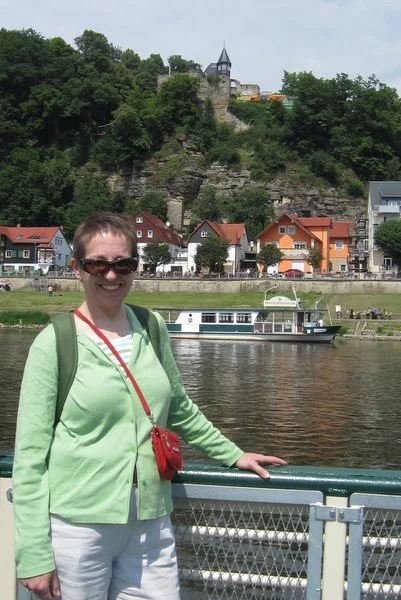 Waiting for the ferry to return so Lisa and I can float across the Elbe to the wine garden on top of the hill behind me. Rathen, Germany, May 2011. Thanks to Lisa Larsen for the photo.