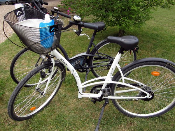 The bike I rented at Hotel Les Grande Chenes to take me to Guédelon Forest. My water bottle and hat ride in the basket.