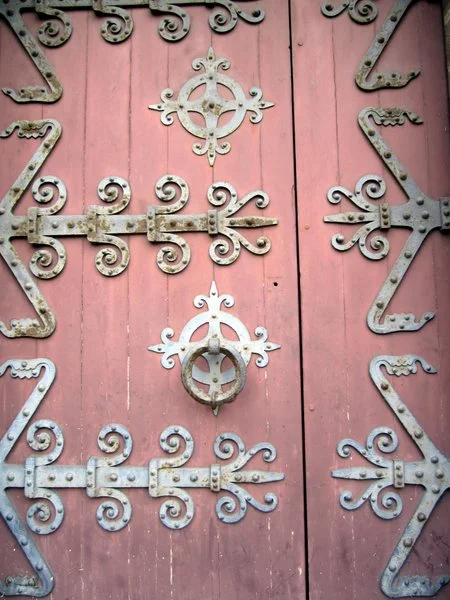 Door at the main entrance to the Abbey aux Dames featuring metal strapwork.
