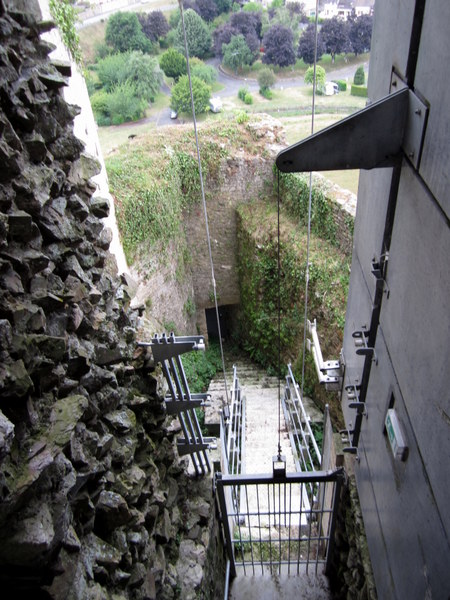 Looking down through the glass and steel structure built to help hold up the Falaise Chateau and to help visitors see its insides.