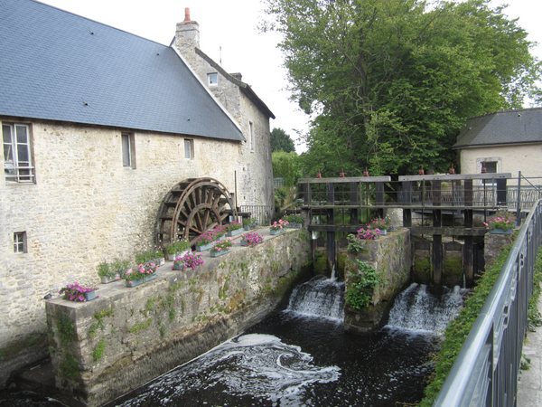 Water wheel along the Aure River in the center of Bayeux, France.