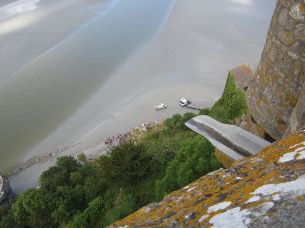 Looking down about midway up the Mont at maintenance going on at the base of the island. The workers drove their vehicles into the sand flats. Hope the tide is not coming in!