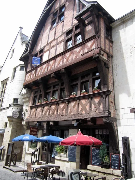 A half-timbered building in Chinon housing a beautiful cafe at street level and probably apartments above.