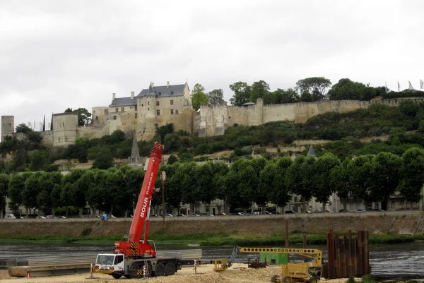  The Chinon Chateau from a view looking east across the river. I think the equipment in the foreground might be for dredging the river.