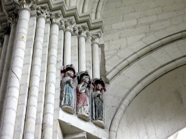 Figurines carved into an archway in the nave of the Church of St. Martin.