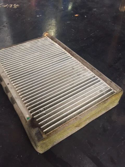 Leakage of the compressor oil from the cooling coil (yellow in color)