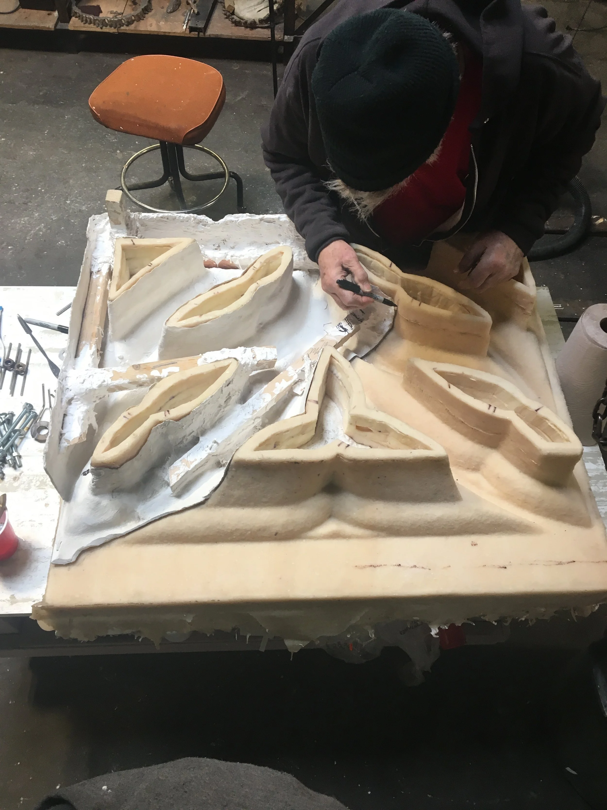 John marks the mold with the needed patterns
