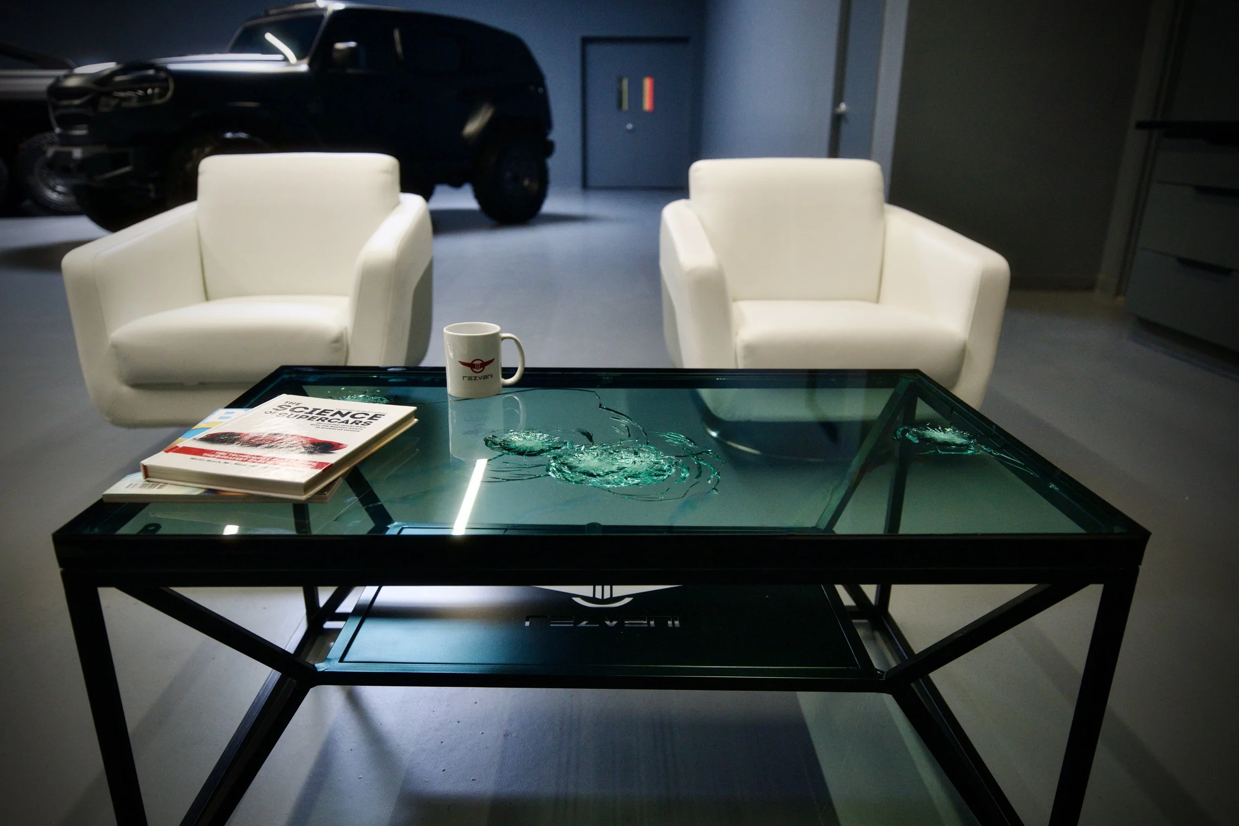 Rezvani Motors bullet proof coffee table conversation piece.jpeg